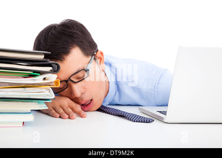 young businessman too weary to asleep on the desk Stock Photo