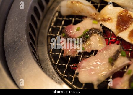 bacon Squid and Eringii Mushroom on a grill Stock Photo