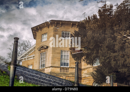 Asgill House reflected in the flooded road during high tide.Old Palace Road,Richmond River side,Richmond-Upon-Thames,England Stock Photo