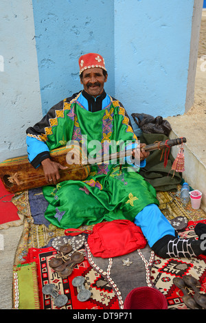 Gnawa musician with guembri, Kasbah of the Udayas (Qasbah des Oudaya), Rabat, Rabat-Salé-Zemmour-Zaer Region, Kingdom of Morocco Stock Photo