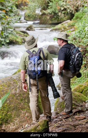 Eco-tourist Photographers. Savegre River. Rainforest. Talamanea Mountains. Costa Rica. Central America. Stock Photo