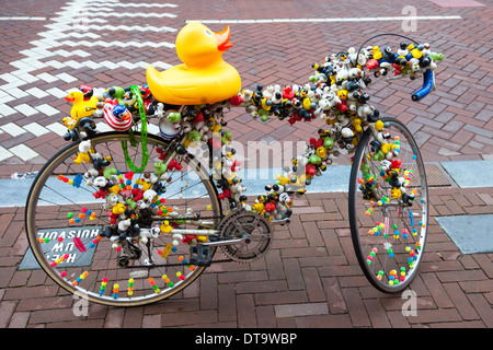 Bicycle decorated with plastic ducks and toys, Amsterdam, Netherlands Stock Photo