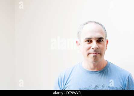 Middle aged baby boomer man on white background with copy space Stock Photo