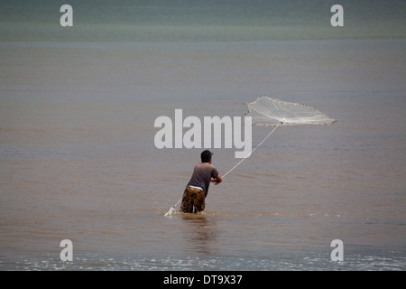 Fisherman throwing a castnet in the Muni lagoon near Winneba Ghana