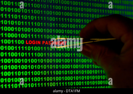 Hand reaching for the words "Login Passwort" with tweezers in a binary code Stock Photo