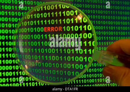 Binary code with the word "Error" viewed through a magnifying glass Stock Photo