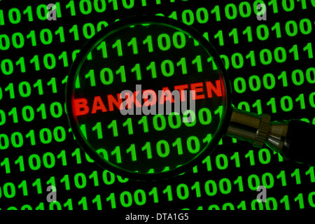Binary code with the word "Bankdaten", German for "Banking Information" viewed through a magnifying glass Stock Photo