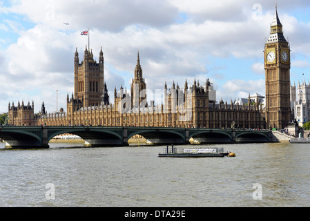 Palace of or Houses of Parliament, with the Victoria Tower, on the River Thames in morning light Stock Photo