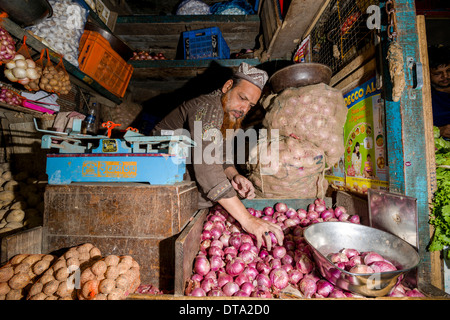 Man selling potatoes and onions at Crawfort Market, Mumbai, Maharashtra, India Stock Photo