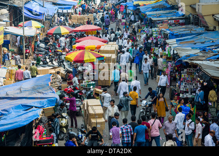 Crowded street with shops at Mangaldas Market, Mumbai, Maharashtra, India Stock Photo