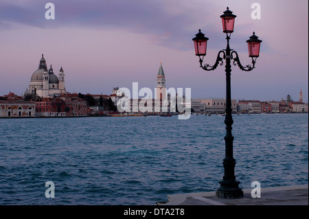 Modern Venetian lantern, in front of Doge's Palace, Palazzo Ducale and St. Mark's Campanile, Venice, Veneto, Italy Stock Photo