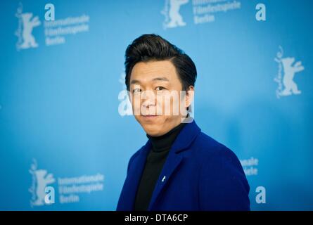 Berlin, Germany. 13th Feb, 2014. Chinese actor Huang Bo poses during the photocall for the movie 'Wu Ren Qu' (No Man's Land) at the 64th Berlinale in Berlin, Germany, 13 February 2014. The film is being shown in competition at the Berlinale which continues until 16 February. Photo: DANIEL NAUPOLD/dpa/Alamy Live News Stock Photo