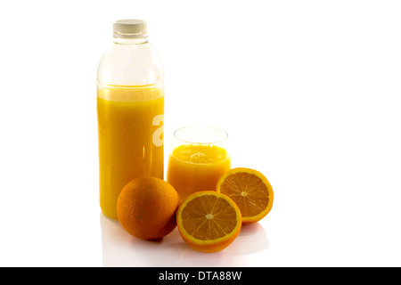 bottle and glass with fresh orange juice isolate on white Stock Photo