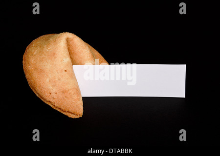 Chinese fortune cookie with blank paper strip for your own good luck message Stock Photo