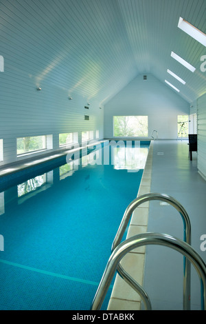 Large private indoor swimming pool in a purpose built building. Stock Photo