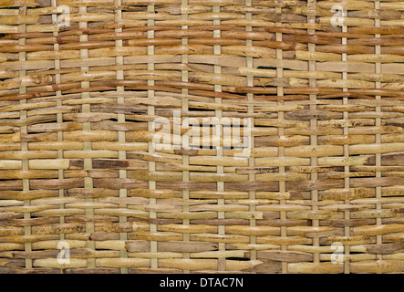 Woven wood wicker fence panel suitable for crafts, picnic or gardening background or wallpaper Stock Photo