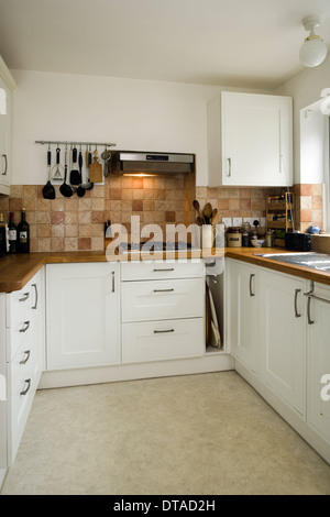 Small contemporary fitted kitchen in white. Stock Photo