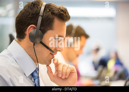 Businessman talking in the micro operator in the office