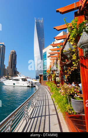 Dubai Marina, restaurant and twisted tower on the back Stock Photo