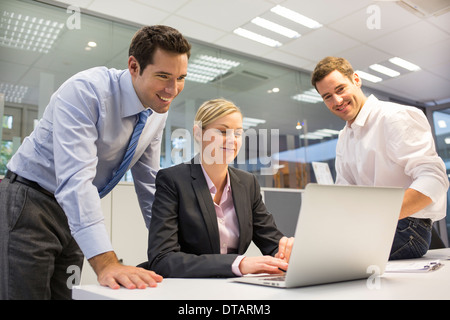A business team of three working in office Stock Photo