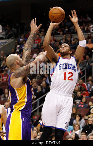 February 7, 2014: Philadelphia 76ers small forward Evan Turner (12) shoots the ball with Los Angeles Lakers center Robert Sacre (50) defending during the NBA game between the Los Angeles Lakers and the Philadelphia 76ers at the Wells Fargo Center in Philadelphia, Pennsylvania. The Lakers won 112-98. (Christopher Szagola/Cal Sport Media) Stock Photo