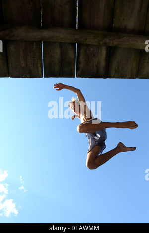 Briescht, Germany, Young makes a jump in the air Stock Photo