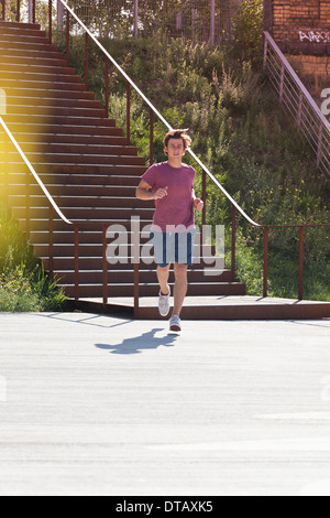 Mid adult man jogging Stock Photo