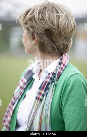 Mature woman looking away, close-up Stock Photo