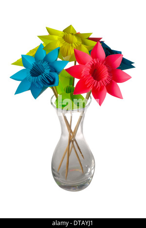 Origami flowers in glass vase isolated on white. Stock Photo