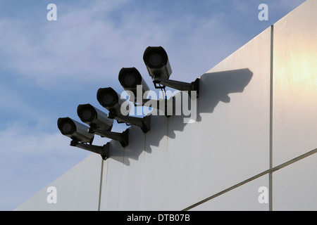Surveillance cameras on wall, low angle view Stock Photo