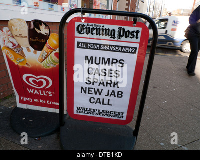Mumps Cases Spark New Jab Call  Evening Post newspaper headline outside newsagent newsagents shop street Swansea Wales UK  Great Britain KATHY DEWITT Stock Photo