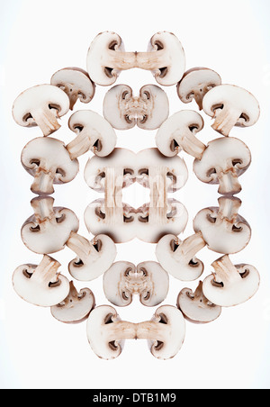 A digital composite of mirrored images of an arrangement of slices of mushrooms Stock Photo