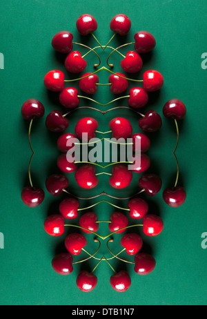 A digital composite of mirrored images of an arrangement of cherries Stock Photo