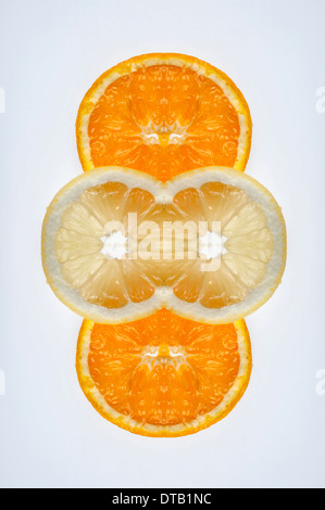 A digital composite of mirrored images of slices of orange and lemon Stock Photo