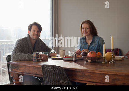 Couple having breakfast at dining table, portrait Stock Photo
