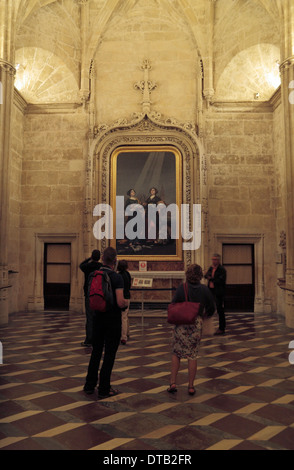 Tourists viewing the Santa Justa & Santa Rufina painting by Goya, Seville Cathedral (Catedral) Seville, Andalusia, Spain. Stock Photo