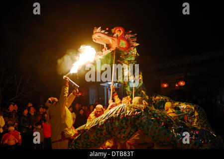 Fuping, China's Shaanxi Province. 13th Feb, 2014. Villagers Perform 