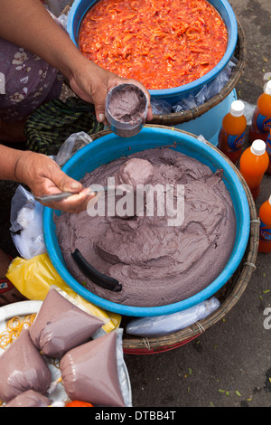 Selling Mam Tom or Fermented Shrimp Sauce at Dong Ba Market Hue Vietnam Stock Photo