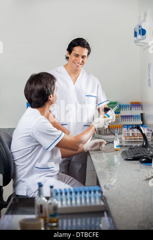 Technicians Scanning Barcode On Specimen Stock Photo
