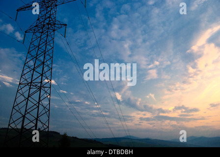 Sunset in Carpatian mountains in summer and electrified track Stock Photo