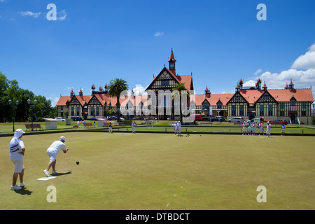 Ladies playing bowls outside the museum of art and history in the old bath house building, Rotorua, North island, New Zealand Stock Photo