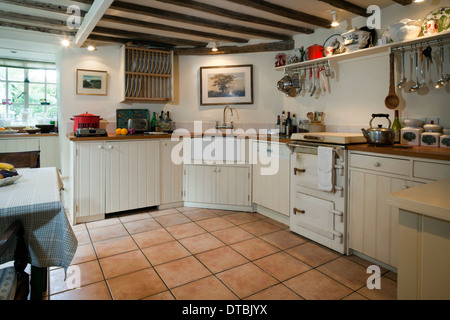 Fitted kitchen with an unusual small range cooker. Stock Photo