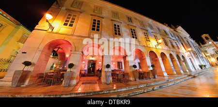 Portugal, Algarve: Nocturnal illuminated arcade building of the 'Columbus Bar' in Faro Stock Photo