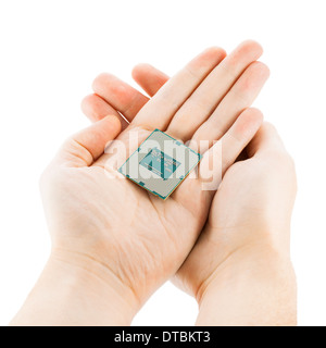 Computer's processor in two hands isolated on a white background Stock Photo