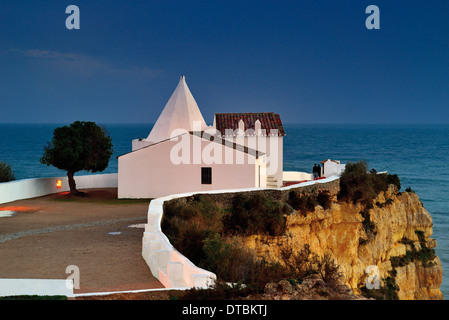 Portugal, Algarve: Nocturnal view to medieval chapel Nossa Senhora da Rocha in Armacao de Pera Stock Photo