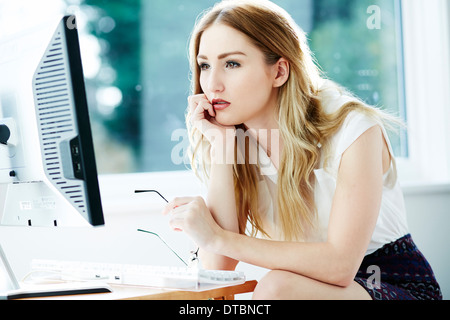 Woman looking concerned Stock Photo