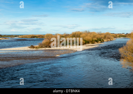 RIVER SPEY ENTERING THE SEA AT SPEYMOUTH WITH TUGNET AND THE SEA IN THE DISTANCE Stock Photo