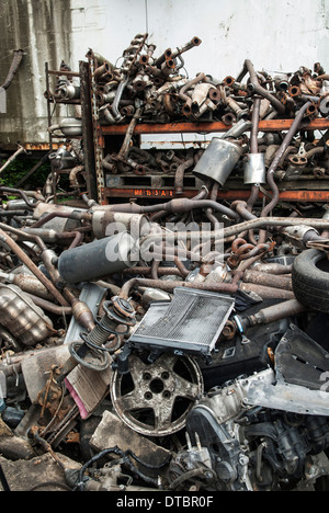 Heap of car parts in a scrap yard UK  Stock Photo