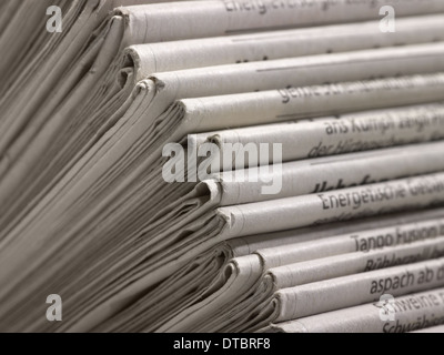 lots of stacked newspapers Stock Photo