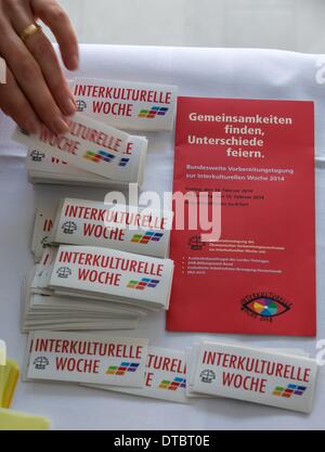 Erfurt, Germany. 14th Feb, 2014. Delegates get promotional materials during the nationwide preparatory meeting for the intercultural week in the Augustinian monastery in Erfurt, Germany, 14 February 2014. This year's Intercultural Week takes place under the motto 'Find commonalities, celebrate differences'. Photo: Michael Reichel/dpa/Alamy Live News Stock Photo